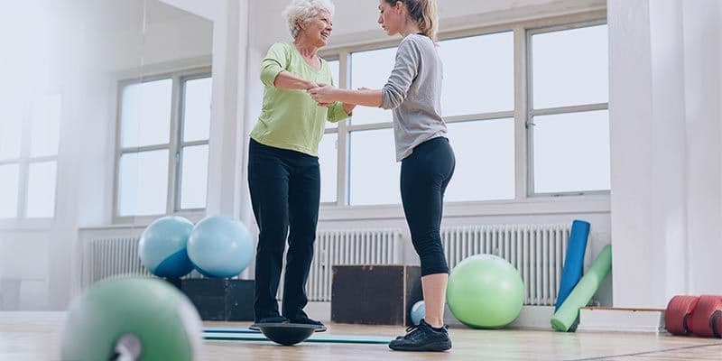 Lady balancing on medicine ball